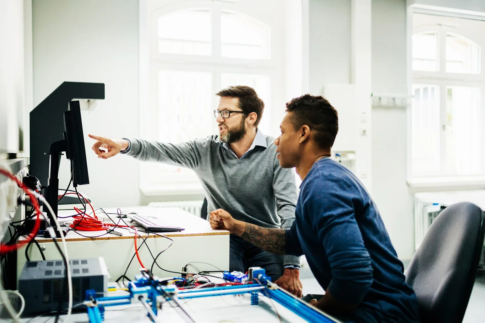 Optomech engineer working on machine vision inspection system