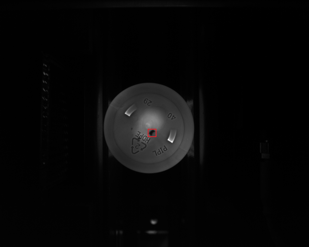 Spot defect on bottle base — detected by BIS base inspection camera