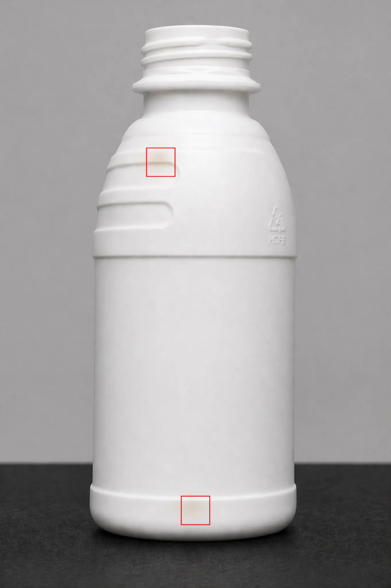 Burn spots on agrochemical bottle sidewall — detected by BIS STD+ sidewall camera