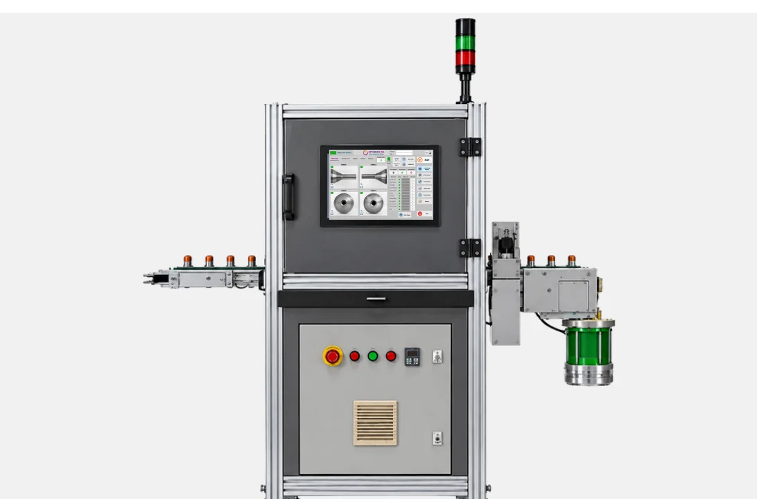 Optomech FDIS Filter Drier Inspection System — enclosed machine with conveyor cradles, 19-inch monitor, and tower light