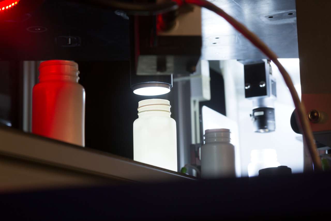 Inside bottle inspection — coaxial camera looking down into bottle neck