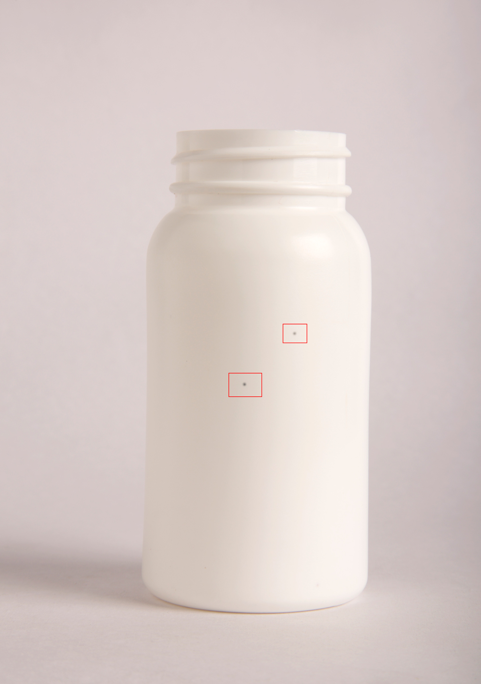 Spot defect on bottle sidewall — detected by BIS sidewall inspection