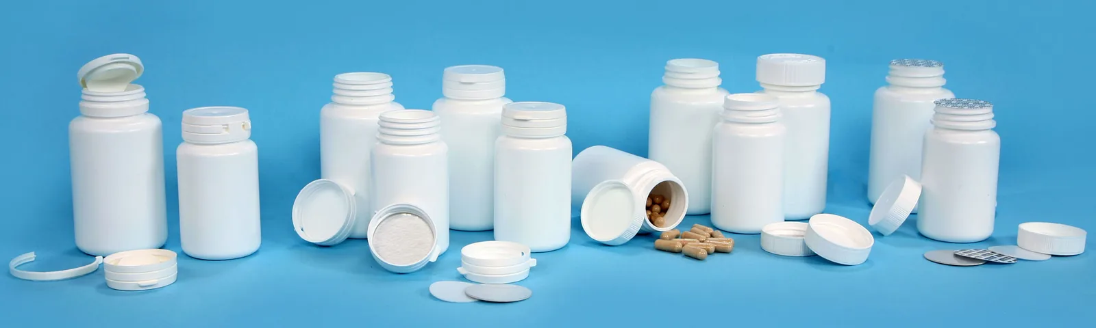 Range of tablet and nutraceutical bottle types for BIS inspection — Optomech
